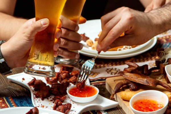 guys-drinks-beer-with-various-snacks