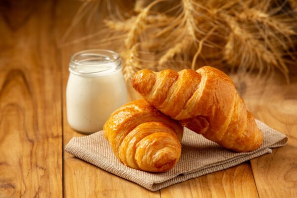 two-loaves-bread-milk-put-glass-old-wooden-floor